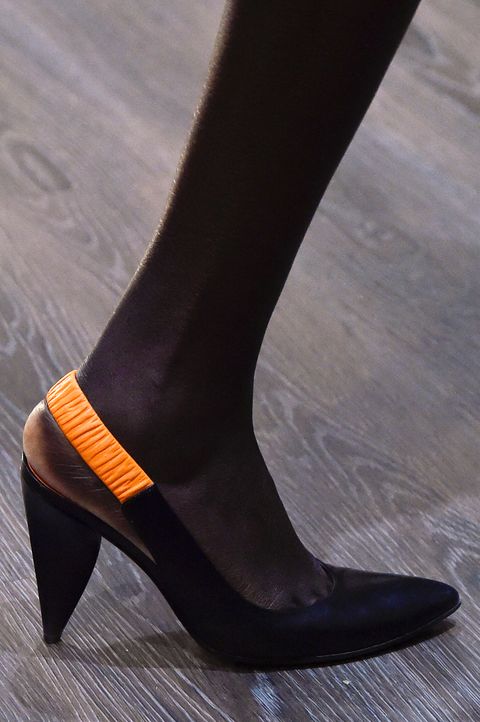 Black pumps with open heels by Eckhaus Latta